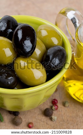 green and black olives in a green oil