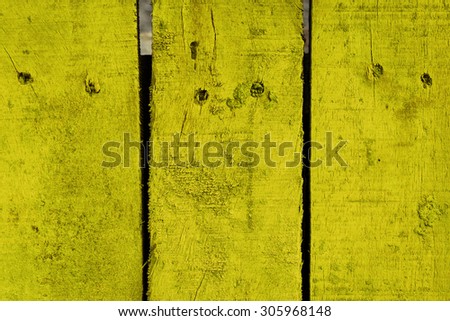 wood plank with yellow color painted background