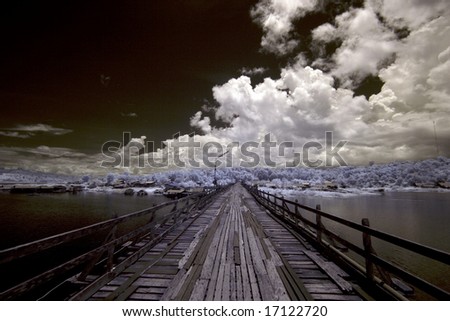 Wooden Bridge across the river ,  Thailand taken in Near Infrared