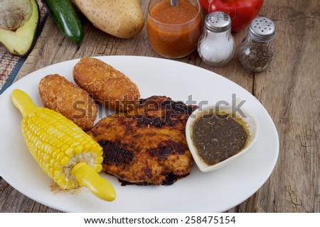 Barbecue chicken ,grill corn and fried mashed on plate