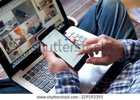CHIANGMAI, THAILAND -OCT 20, 2015:A man touch on screen new Apple iPhone 6 Plus smartphone device open google application.
