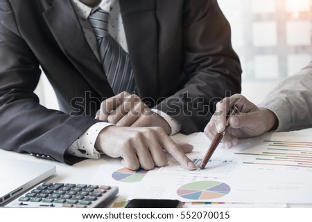 Business adviser analyzing financial figures denoting the progress in the work,consult concept.