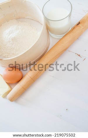 Dumpling preparation - flour, egg, milk, butter, rolling pin