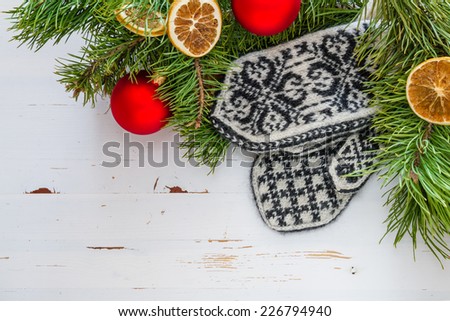 Christmas decorations - tree, balls, oranges, mittens with traditional ornament