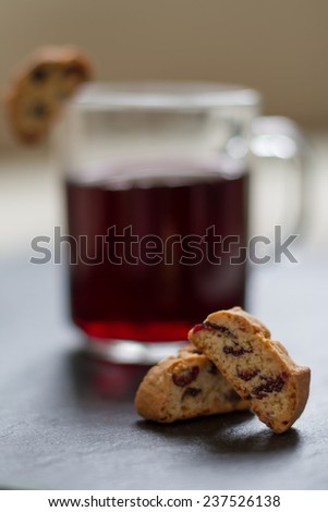 Red wine in glass cup with italian cookies