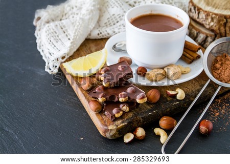Chocolate background - chocolate, candy, cinnamon sticks, nuts, sugar, cherry, lemon, cocoa, hot chocolate, dark stone background
