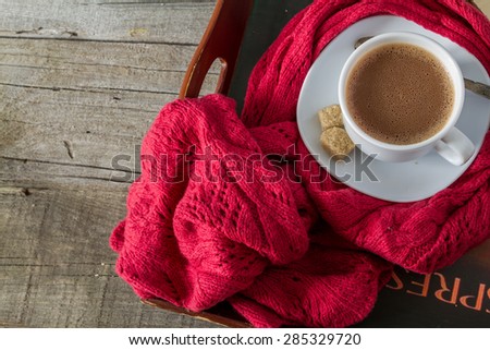 Autumn lifestyle - hot chocolate, tray, warm blanket, rustic wood background, top view