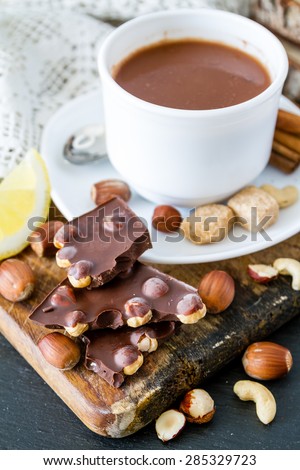 Chocolate background - chocolate, candy, cinnamon sticks, nuts, sugar, cherry, lemon, cocoa, hot chocolate, dark stone background