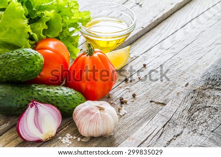 Greek salad ingredients, rustic wood background