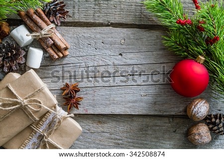Christmas presents and symbols, rustic wood background, copy space, top view