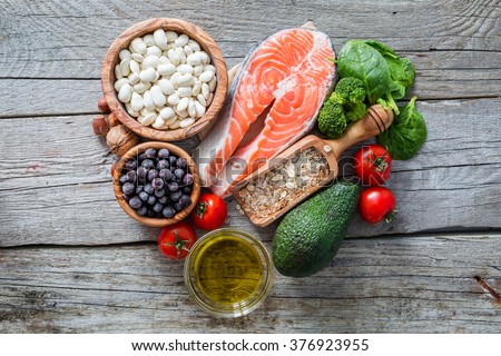 Selection of food that is good for the heart, rustic wood background