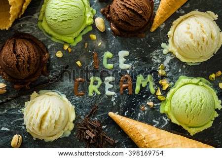 Selection of colorful ice cream scoops in white bowls, copy space