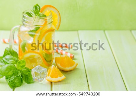 Orange and basil detox water, copy space