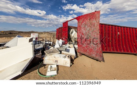 Broken appliances at the scrap metal dumpster.