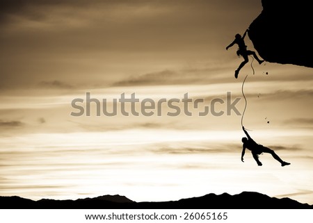 Team of climbers in trouble clinging to a cliff for dear life in The Sierra Nevada Mountains, California.