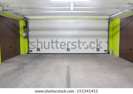Garage door. Underground garage located under modern house estate block of flats