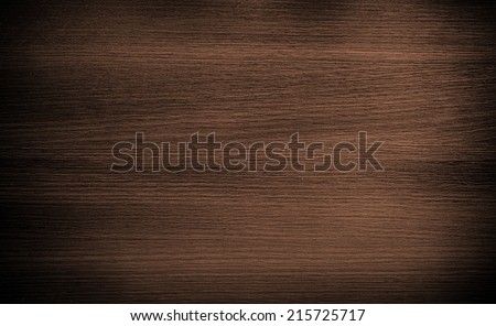 Texture of wood plank brown background closeup. Picture of natural wood pattern. Dark color shadows and vignette dramatic light effect.