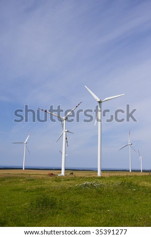 Wind power station against the blue sky