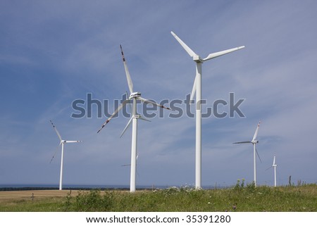 Wind power station against the blue sky