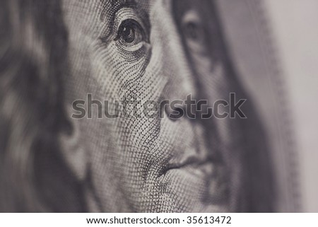 Benjamin Franklin Portrait from Hundred Dollar Bill of American Currency, narrow focus on eyes.