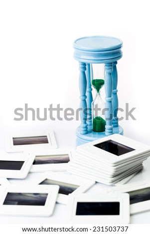 Pile of old slide with sand clock concept for obsolete