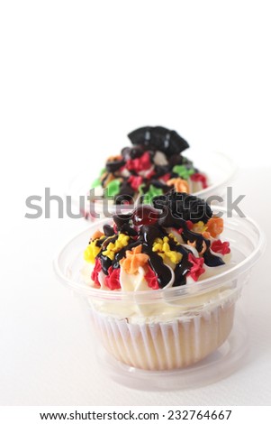 two fancy cupcake on white background