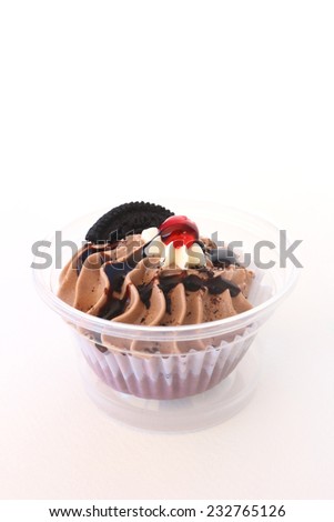 chocolate cup cake with jam and cookie.