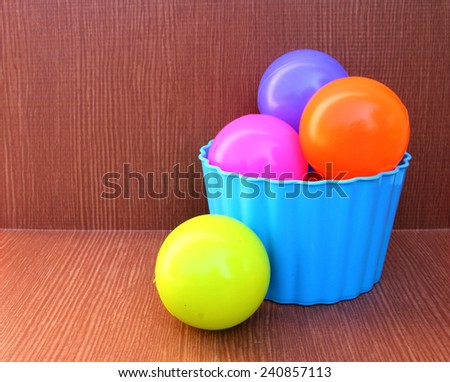color balls are in the blue plastic box