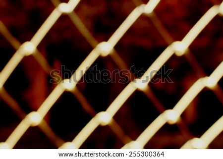 image of blur net fence in red tone