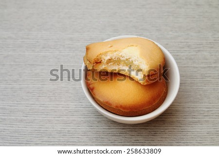 bite bread in small bowl in soft focus