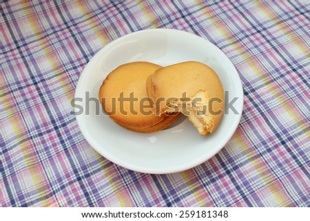 bite bread in white plate on linen