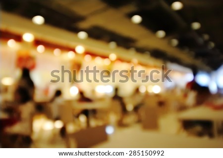 blur indoor restaurant with light in warm tone