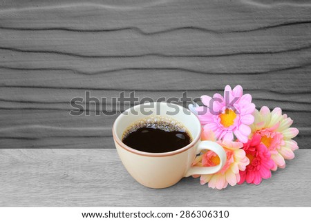black coffee and bunch of flower on  black and white  background