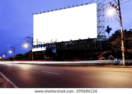 billboard at night time with blur and flare from street light