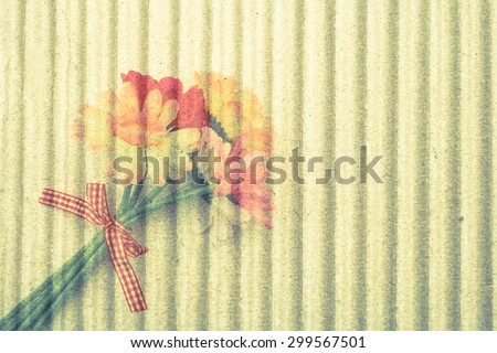 bunch of artificial flower on crepe paper background ,vintage tone