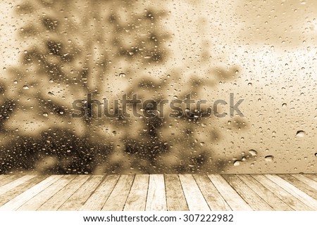 wet perspective floor with blur drop on mirror with dark tree background ,vintage tone