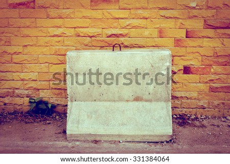 concrete barrier at the block wall