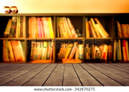 old perspective wooden floor on blur book shelf background