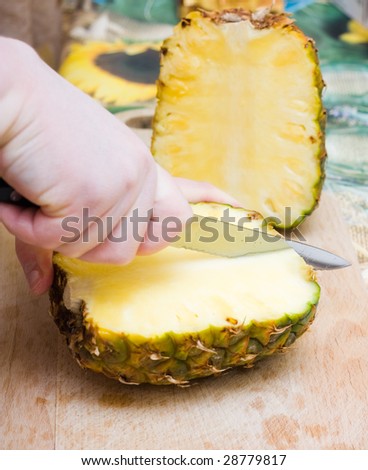 cutting pineapple