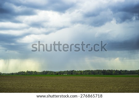 rural landscape with rain clouds