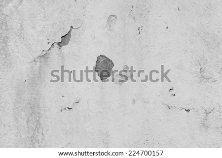 Faded white painted wall with peeing paint and missing artex, an ideal textured background.