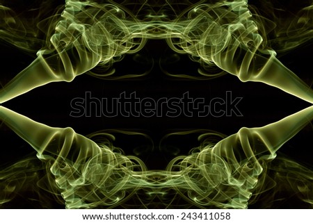 Smoky symmetry abstract pattern.  Lime yellow smoke flipped and rotated to form symmetrical shape.