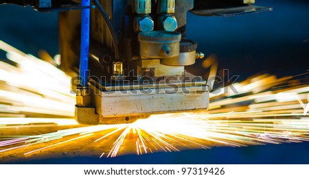 Laser cutting with sparks close up