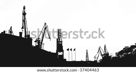 Silhouette of portal cranes in harbor. Isolated.