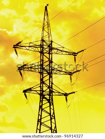 Electric power line on the golden sky background