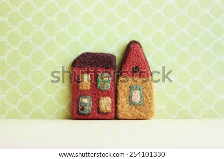 real estate, little decorative houses on light background