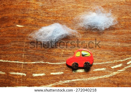 little red car on wooden background, decorative landscape, card