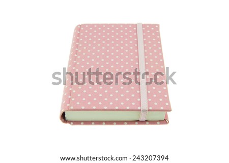 Pink color cover fabric note book isolated on white background