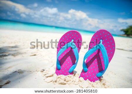 Pink beach flip flops and on tropical sand beach Thailand