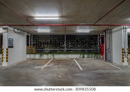 Parking garage interior neon lights in dark